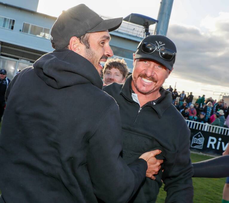 The Rock-Yerong Creek co-coach Brad Aiken (right) celebrates with counterpart Heath Russell after the final siren. Picture by Les Smith
