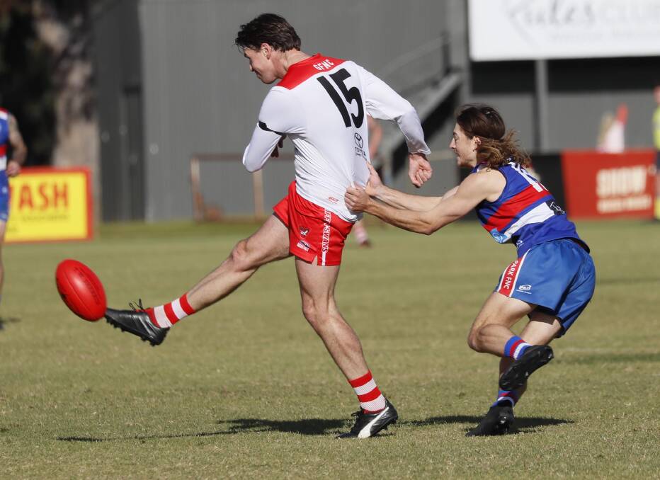 Griffith's Henry Delves gets his kick away during the season. Picture by Les Smith