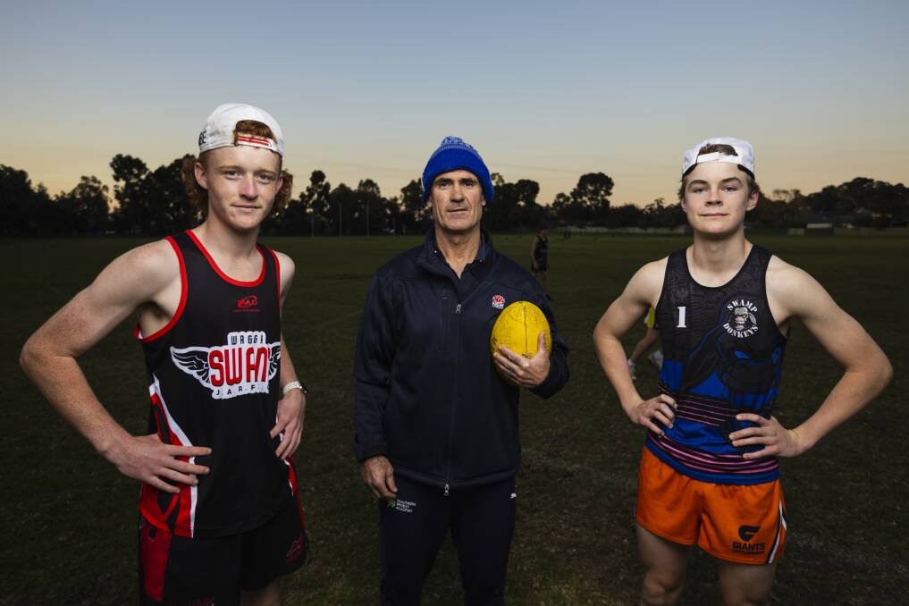 Shane Lenon alongside Wagga Swans' under 15 vice-captain Judd Withers (left) and captain Billie Burns (right) at training at Anderson Oval. Picture by Ash Smith