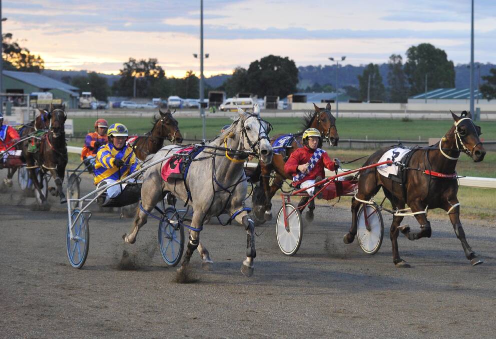 BARNSTORMING FINISH: Rusty Bullet sweeps down the outside to win the Nesbits Furniture Pace (1755m) at Wagga Paceway on Saturday night. Pictures: Laura Hardwick