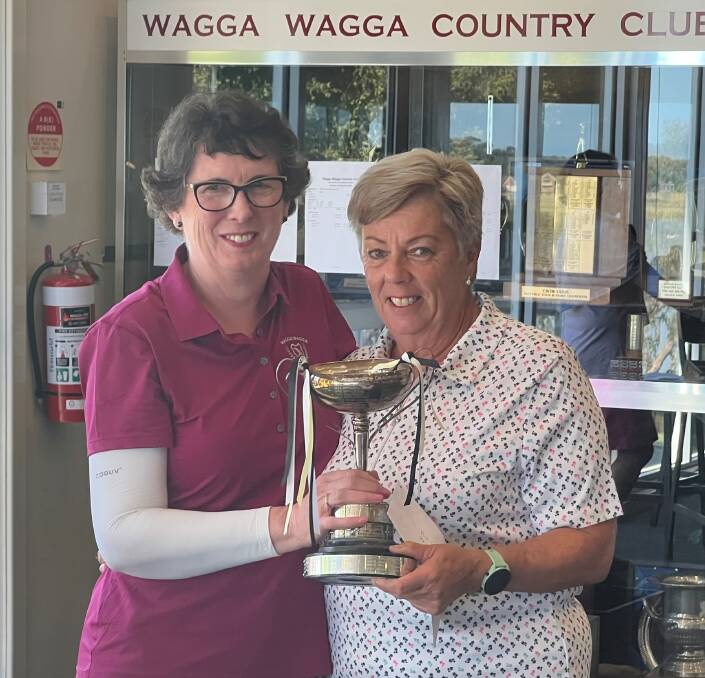 Sandra Schultz (right) receives her trophy for the women's club championships at Wagga Country Club from women's president Carmel Adamcewicz. Picture supplied