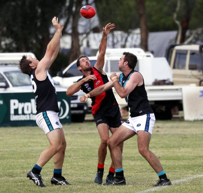 Marrar forward Brad Turner competes against two Northern Jets opponents in the opening round at Langtry Oval. Picture by Les Smith