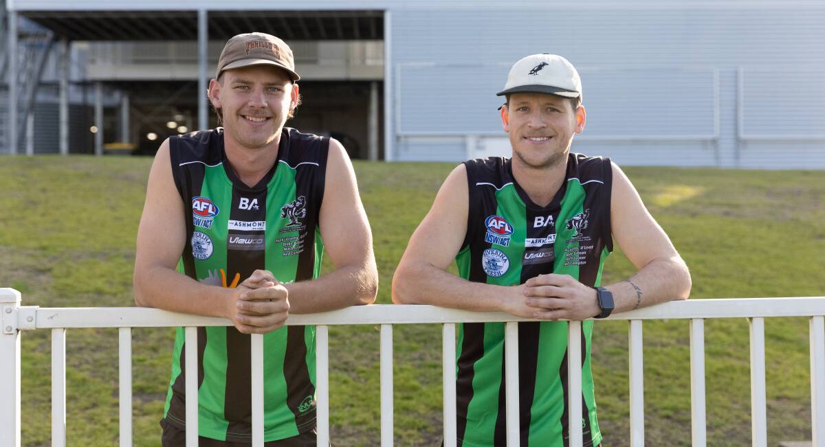 Cody and Jesse Cool show off the jumpers the Magpies will wear on Saturday as they compete for the Mark 'Grunter' O'Leary Memorial Shield against East Wagga-Kooringal. Picture by Madeline Begley