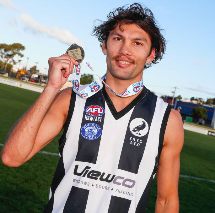 The Rock-Yerong Creek premiership hero Liam Lupton shows off his Nitschke-Schmidt Medal for best-on-ground in the Farrer League grand final on Saturday. Picture by Les Smith