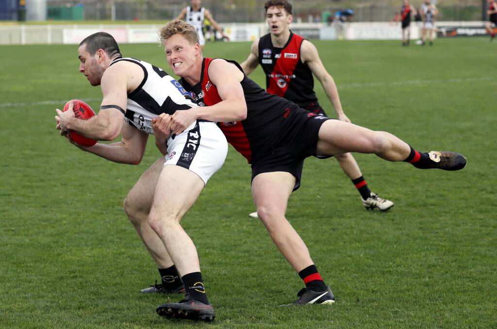 The Rock-Yerong Creek star Riley Budd gets wrapped up by Marrar's Liam James in Saturday's grand final at Robertson Oval. Picture by Les Smith