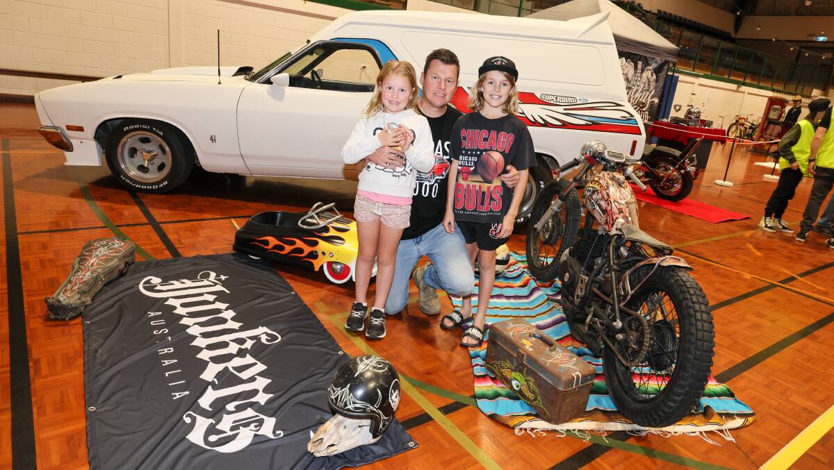 Casey Johnson from Wagga with kids April, 7, and Jimmy, 9, with Casey's 1979 Ford Falcon Panel Van. Picture by Les Smith 