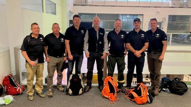 Forestry Corporation's Rebel Talbert, Jamie Harris, Anthony Post, Vince Bolton, Matt Model, Jarod Addinsall, Dave Anderson and Ross Dickson ready to fly out to Canada to join the firefighting effort. Picture supplied