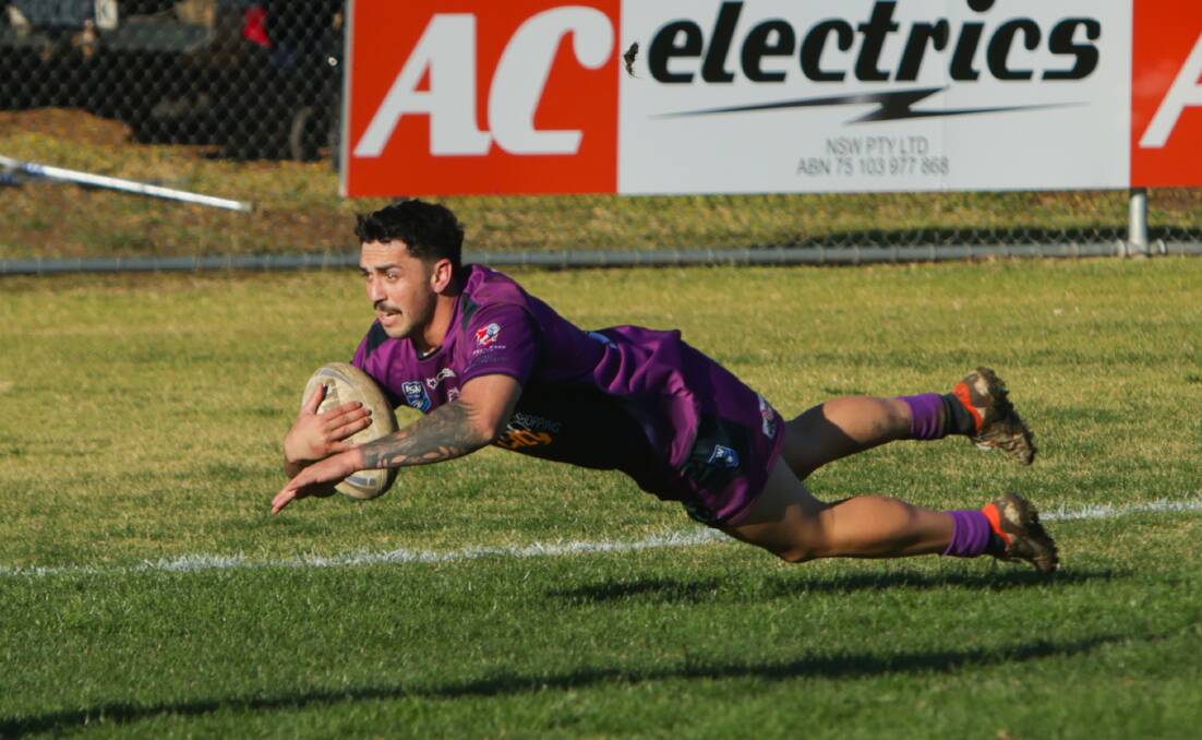 Josh Siegwalt goes over for a try in Southcity's narrow loss to Young on Sunday.