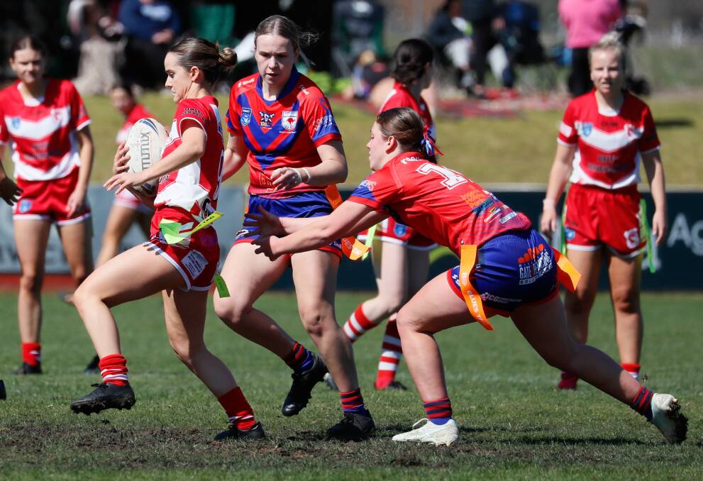 Jessica Wendt tries to tag McKenna Henman in Kangaroos' loss to Temora in the major semi-final. Picture by Les Smith