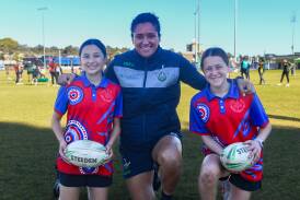 Canberra Raiders NRLW captain Zahara Temara with Henschke Primary School students Aleera Hillier and Allie Slorach at the schoolgirls clinic on Friday. Picture by Bernard Humphreys