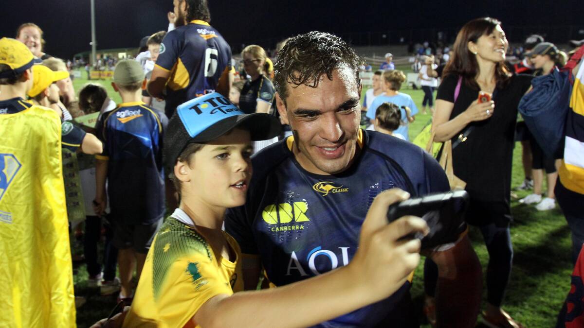 Will Scott of Temora takes a selfie with Tom Staniforth after the ACT Brumbies last played a trial game in Wagga in 2016.