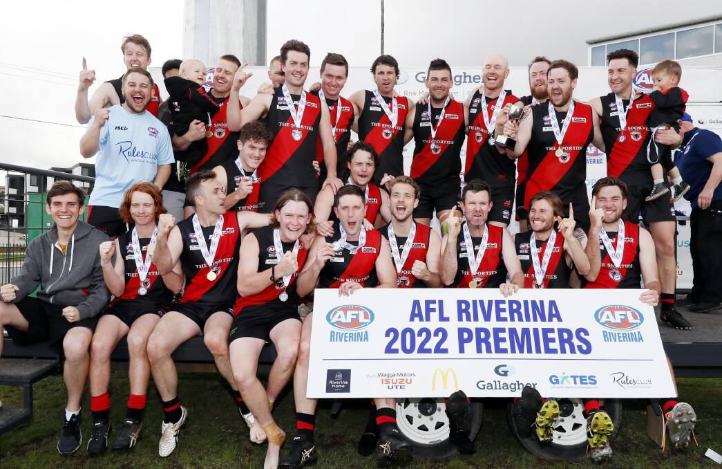 Marrar sing their song after winning the reserve grade grand final over Charles Sturt University at Robertson Oval on Saturday. Picture by Les Smith