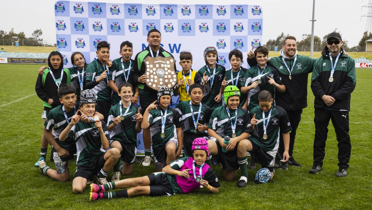 Sydney South West celebrates their NSW PSSA rugby league championships title win at Equex Centre on Thursday. Picture by Ash Smith