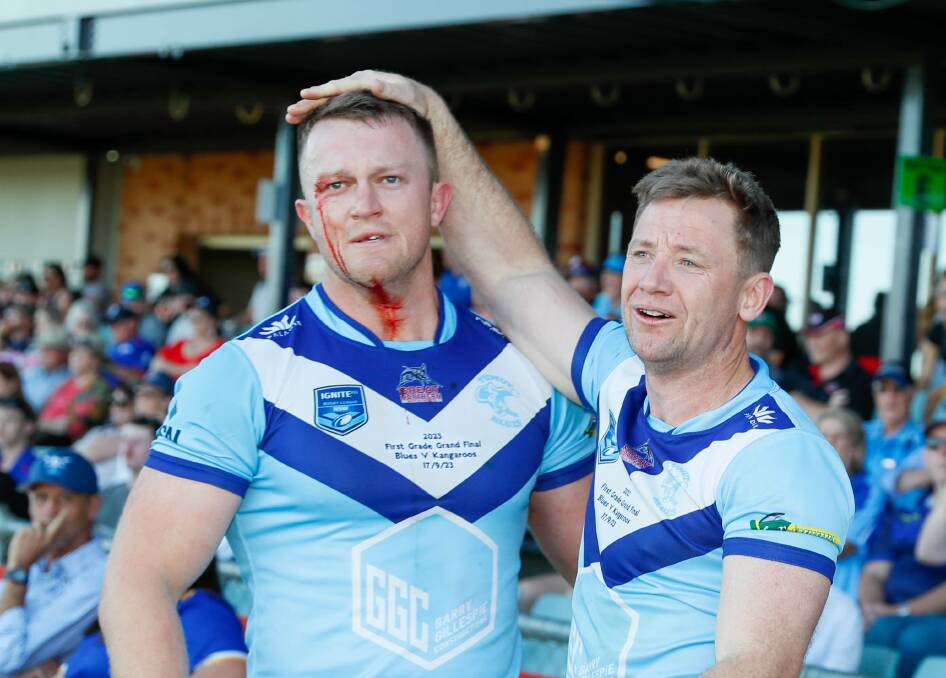 Zac Masters and Dean Bristow celebrate Tumut's come-from-behind win over Kangaroos in the Group Nine grand final on Sunday. Picture by Les Smith