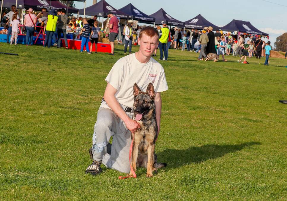 Wagga Christian College year 12 student Braeden Pearce with nine-month-old German Shepherd shorthair Maddie, doing a demo with the Junee Dog Sport Club at the school's fete on Saturday. Picture by Les Smith 