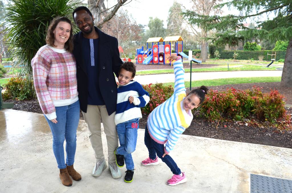 Carly Shepherd and Pacifique Mudacumura celebrate their first reunion in six years with their children, six-year-old twins Serena and Jayden. Picture by Taylor Dodge