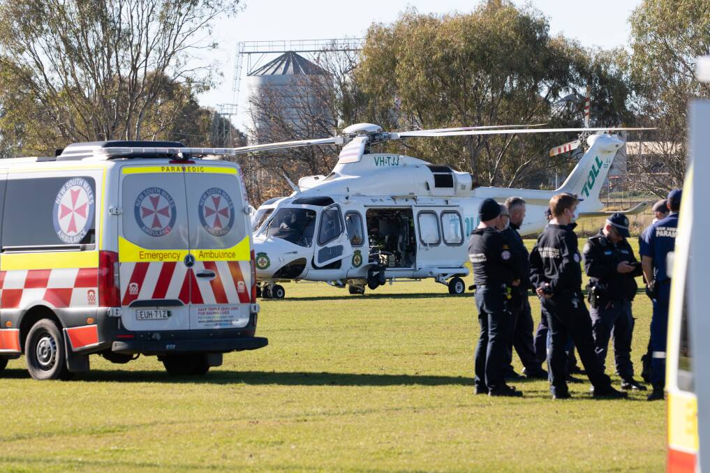 A rescue helicopter lands at Junee's Laurie Daley Oval on Wednesday afternoon following an incident at the nearby jail involving two inmates. Picture by Madeline Begley