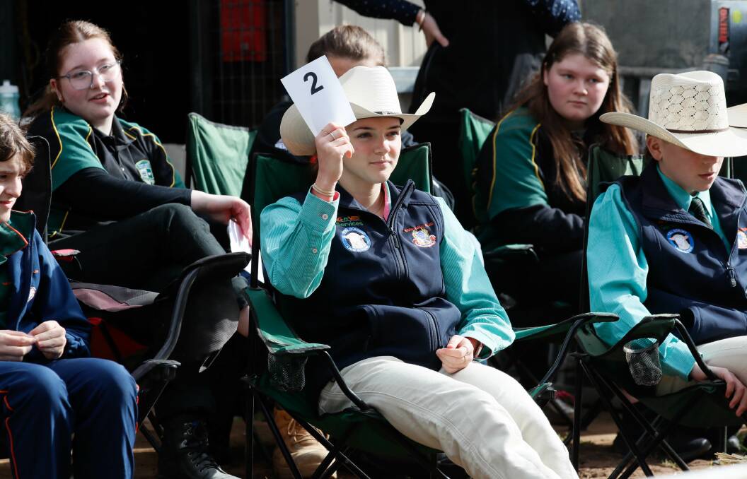The Riverina Anglican College advanced student Indi Dawson bidding while she waits to compete in the Interschools Young Auctioneers Competition. Picture by Les Smith 