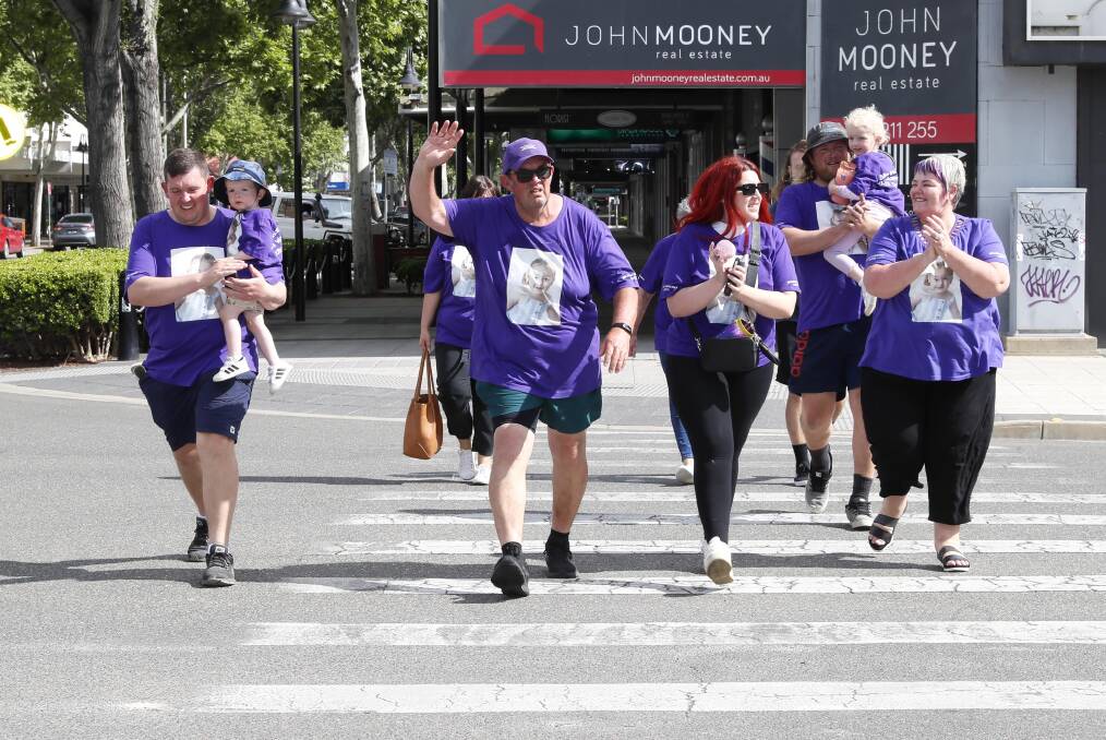 Loved ones joined David Hill on the last stretch of his 131-kilometre trek from Albury to Wagga on Sunday in honour of great niece Billie Grace Richards. Picture by Les Smith 