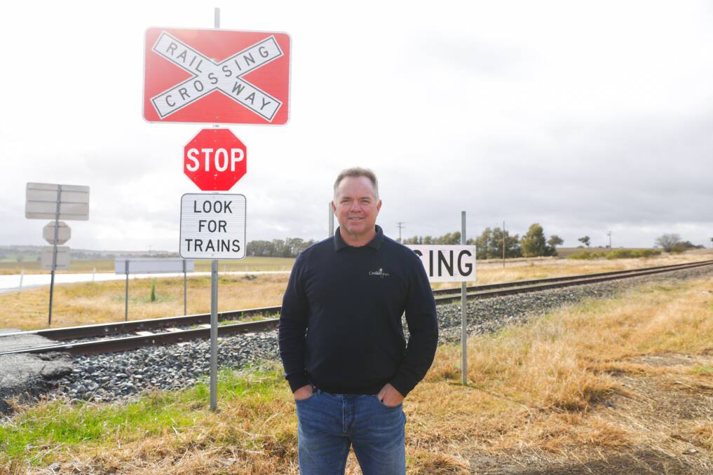 Croker Grain trade manager Lyndon Benecke welcomes a speed reduction at the Rockview level crossing but says he would still prefer a boom gate. Picture by Tom Dennis 