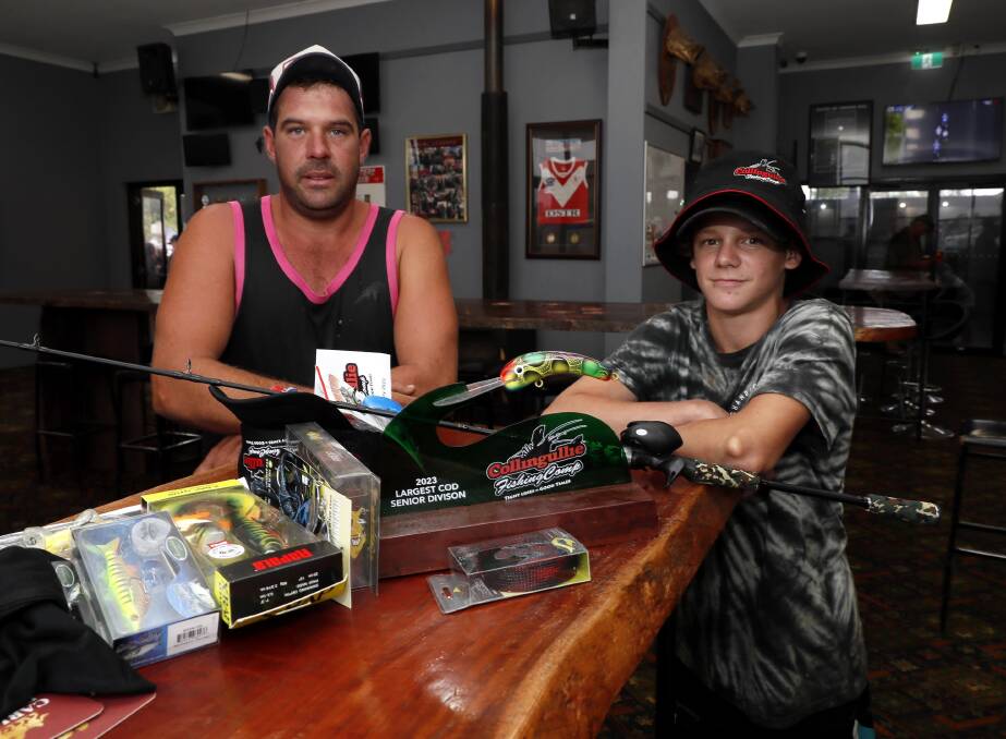 Senior divison prize winner for the biggest cod, Holbrook's Ben Geppert with his 15-year-old cousin Nick Woods from The Rock. Picture by Les Smith 
