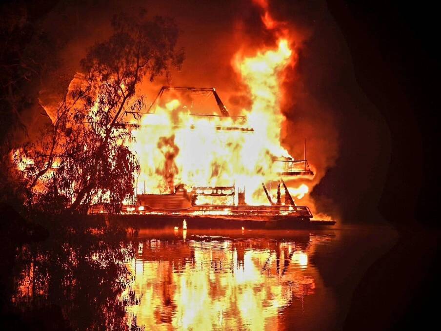 A three storey houseboat has been left destroyed after an early morning blaze. Picture by Fire and Rescue NSW