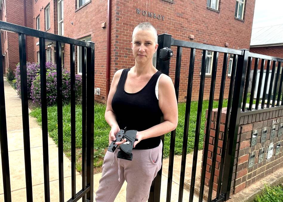 Wagga's Melissa Burden is fed-up with housing after locks were placed on a newly erected fence at the Womboy unit complex on Edward Street. Picture by Taylor Dodge