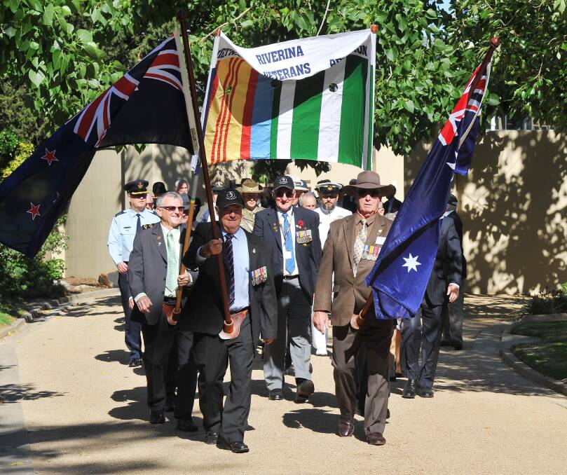 MARCHING: Vietnam veterans march along Baylis Street to the Victory Memorial Gardens for the 38th Riverina Vietnam Veterans Reunion. Picture: Kieren L Tilly