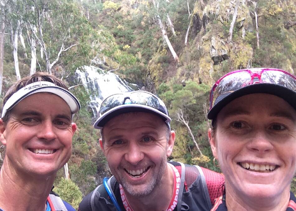 ENJOYING THE SCENERY: George Russell, Pat Burke and Roylene Stanley at a waterfall along the Hume and Hovell 100km marathon trail. 