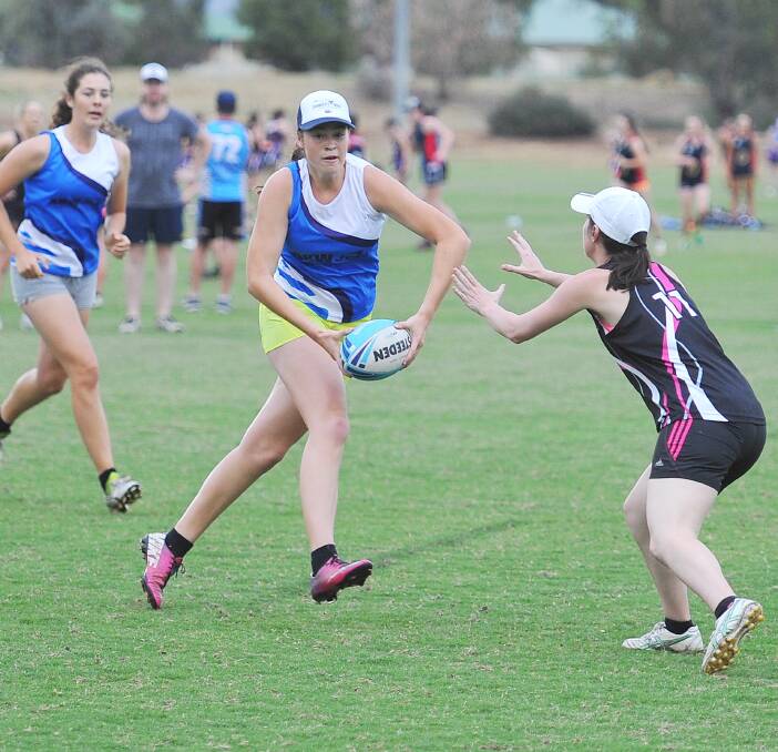 CLOSE COMPETITION: The women's premier league game is intense, with AKW Jets player Clare Vearing putting on the brakes, coming out with a 4-4 draw to the Bar Up Bullbars. Picture: Kieren L. Tilly