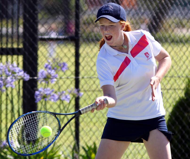 POWER: Josephine Cox, 14, produces a powerful forehand hit on Saturday at the tennis. Picture: Les Smith