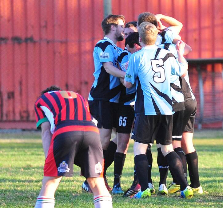 TRIUMPHANT: Cootamundra players celebrate one of four goals in their 4-3 victory over Lake Albert at Rawlings Park on Sunday. Picture: Kieren L. Tilly