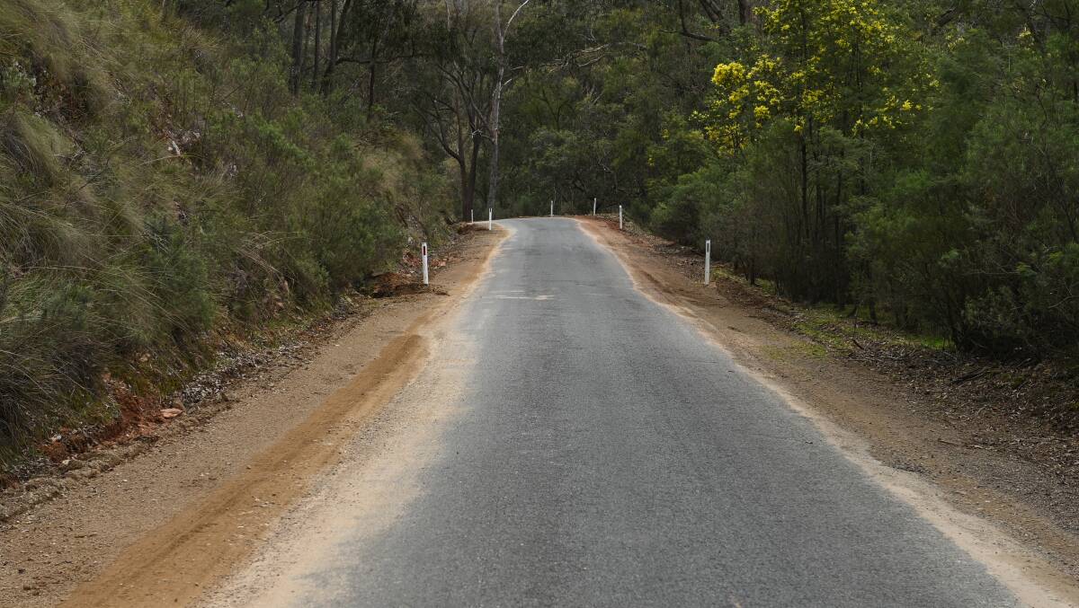 The narrow and regularly patched Tunnel Road which leads from Woomargama to the lookout. Picture by Mark Jesser