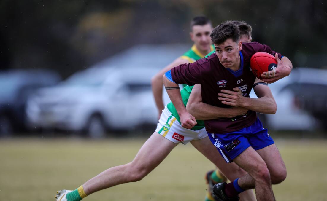 Culcairn's Harrison Doolan is caught in a strong tackle by his Brookers opponent. Picture by James Wiltshire