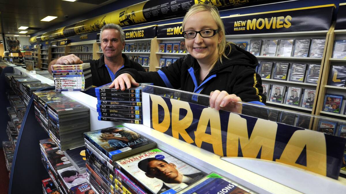 COMING SOON: Blockbuster Kooringal owner Brian Judd showing off the store's collection with Claire Maffescioni as it moves to subscriptions. Picture: Les Smith