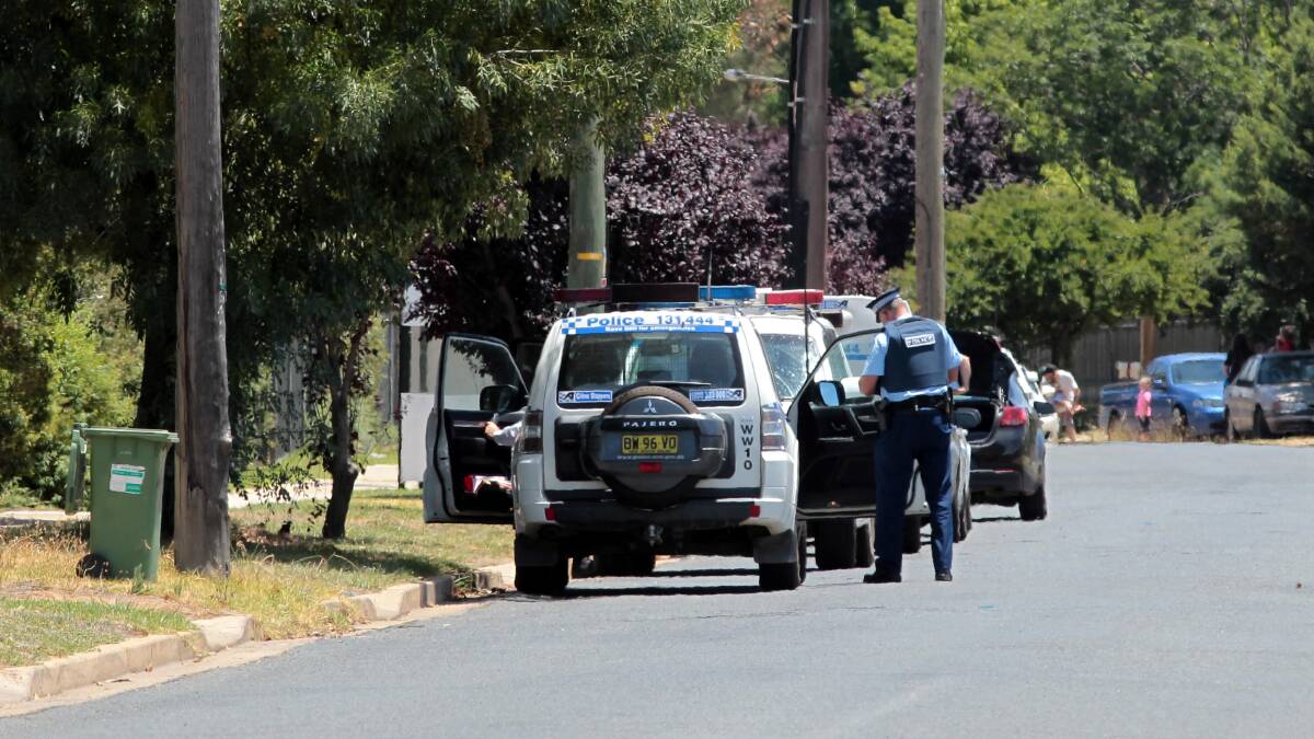 ON ALERT: Police lock down McKell Avenue in Mount Austin after reports of gunfire Wednesday afternoon. Picture: Les Smith
