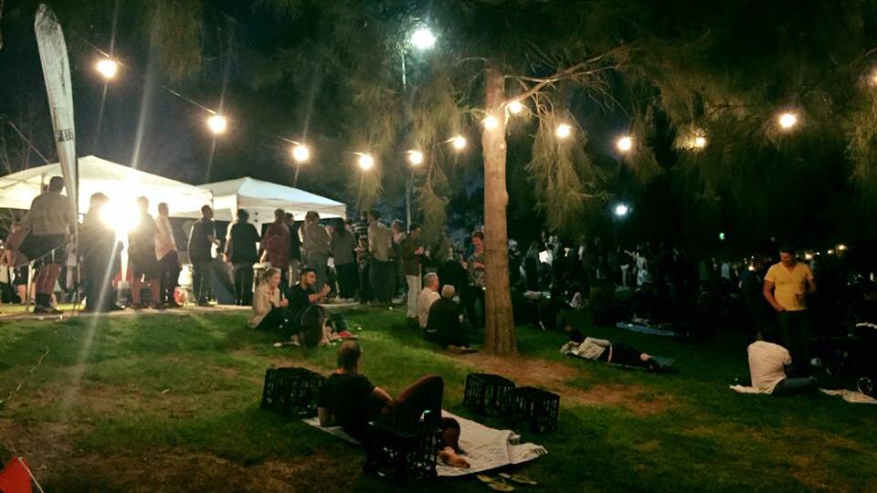 UNDER THE STARS: Revellers at last week's Cork and Fork Festival take a moment to wine at dine at Wagga Beach. Picture: Supplied