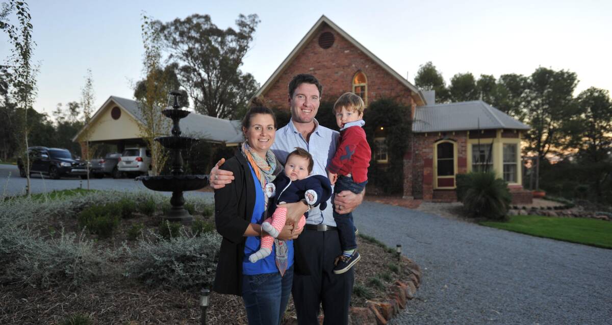 FROM MELBOURNE TO WAGGA: Sophie and Josh Walsh with their children Isobel, 4 months, and Charlie, 2, as calls grow to attract more city people to the city.