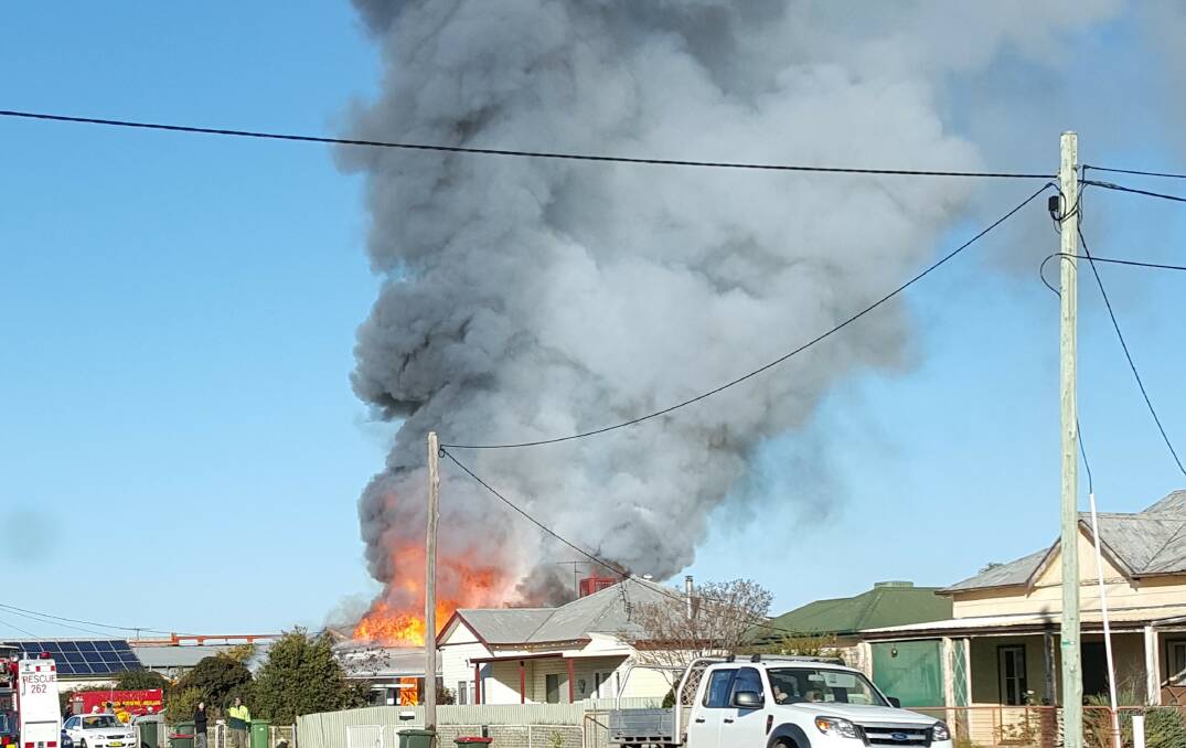 WELL ALIGHT: Resident Matt Hayes captured the ferocity of a house fire at Ganmain at 8.55am on Wednesday morning.