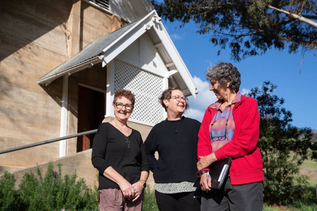 Oura Progress Association's Sue Munro, Sue Thomas and Den Pleming are ready to open the former church as a flood evacuation centre. Picture by Madeline Begley