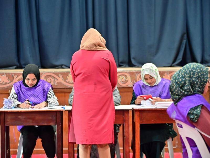 Maldivians are voting in parliamentary elections, in a ballot crucial for President Mohamed Muizzu. (AP PHOTO)