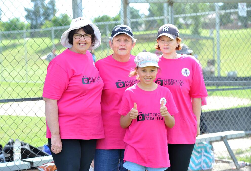 BATTING FOR CHARITY: Annette Saint Clair, Rose Mary Clarke, Annette Francis and Abby Henman, 9, took part in the charity softball match. Picture: Laura Hardwick