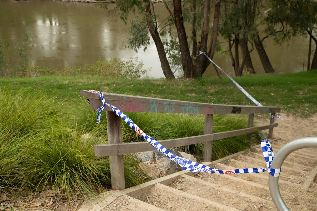 A section of the walking track along the river near Cadell Place was been taped off by police. Picture by Madeline Begley