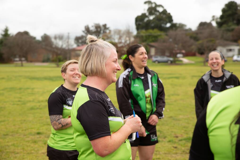 The South Wagga women's squad sing to Deonie Burns on her 43rd birthday at Forest Hill Oval. Picture by Madeline Begley.