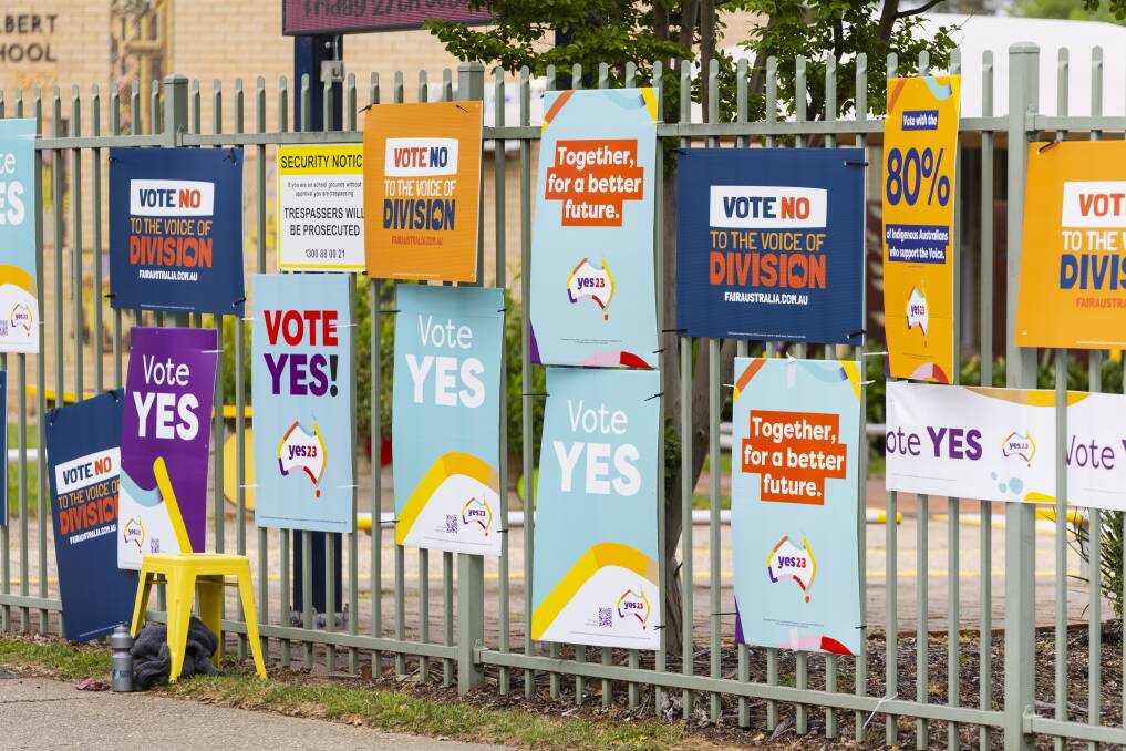 Voters at Lake Albert Public School are met with a barrage of signs, mostly for the 'Yes' campaign, during Voice to Parliament referendum day on Saturday. Picture by Ash Smith
