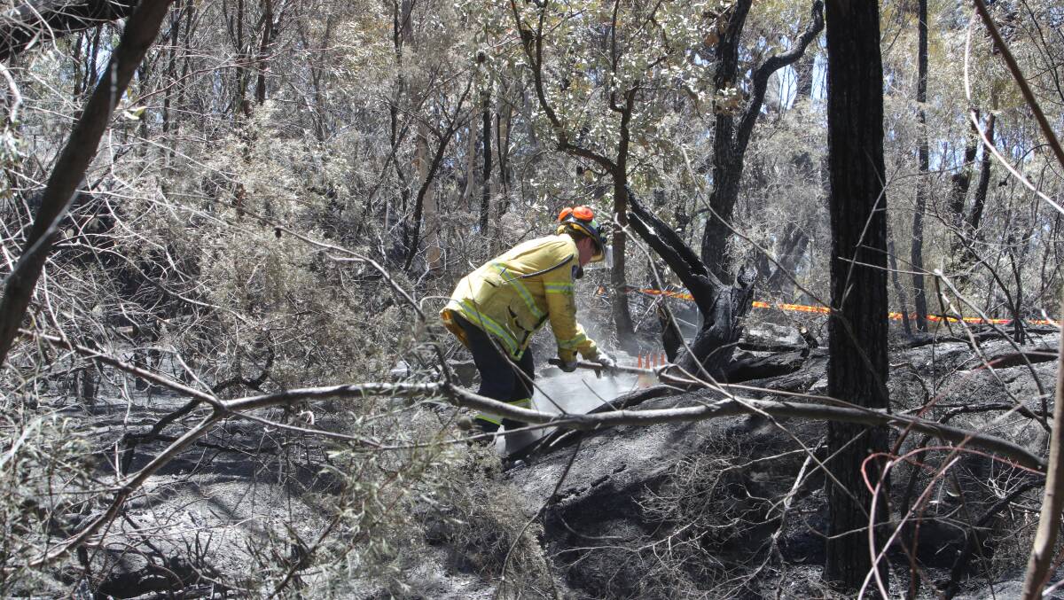 RFS volunteers continue to work at the scene of Boxing Day's fatal plane crash at Appin. Picture by Sylvia Liber.