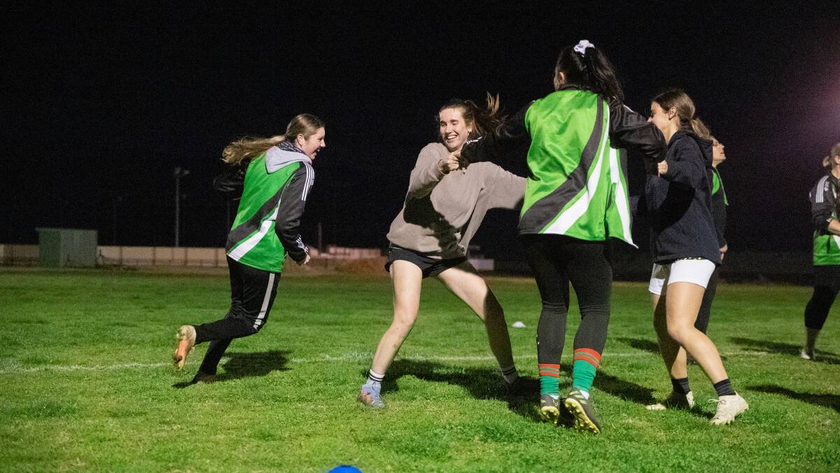 Molly Surian (left) and other members of the South Wagga women's squad warm up for a Tuesday night training session at Wagga Showground. Picture by Madeline Begley