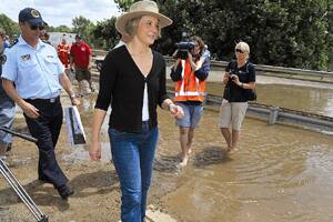 AT FIRST HAND: NSW Premier Kristina Keneally visits Wagga yesterday to see for herself the damage being done to Wagga by the rising floodwaters.