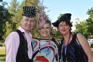 A FASHION HAT-TRICK: Three consequetive dazzling hats were worn by (from left) milliner Neil Grigg, MC for the night Susie Elelman, and milliner Rosie Boylan at the International Millinery Forum official launch party last night. Picture: Michael Frogley