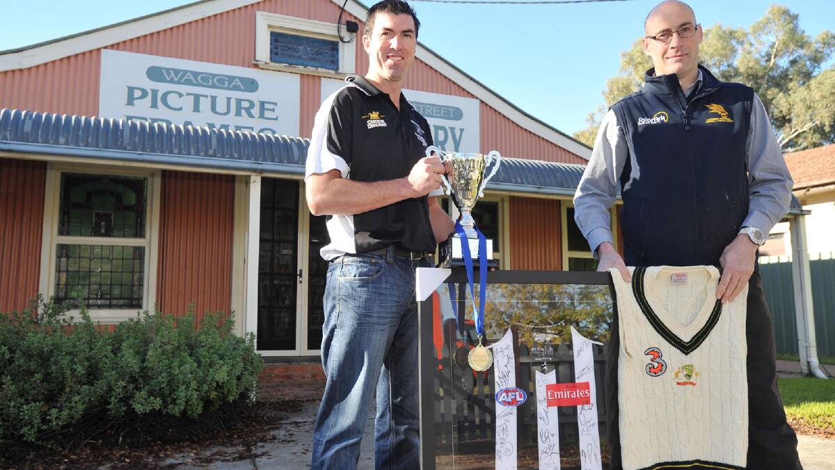 Mark O'Leary Cup coaches East Wagga-Kooringal's Chris Jackson and TRYC's Michael Mazzocchi outside Wagga Picture Frames ahead of this weekend's game. Picture: Alastair Brook